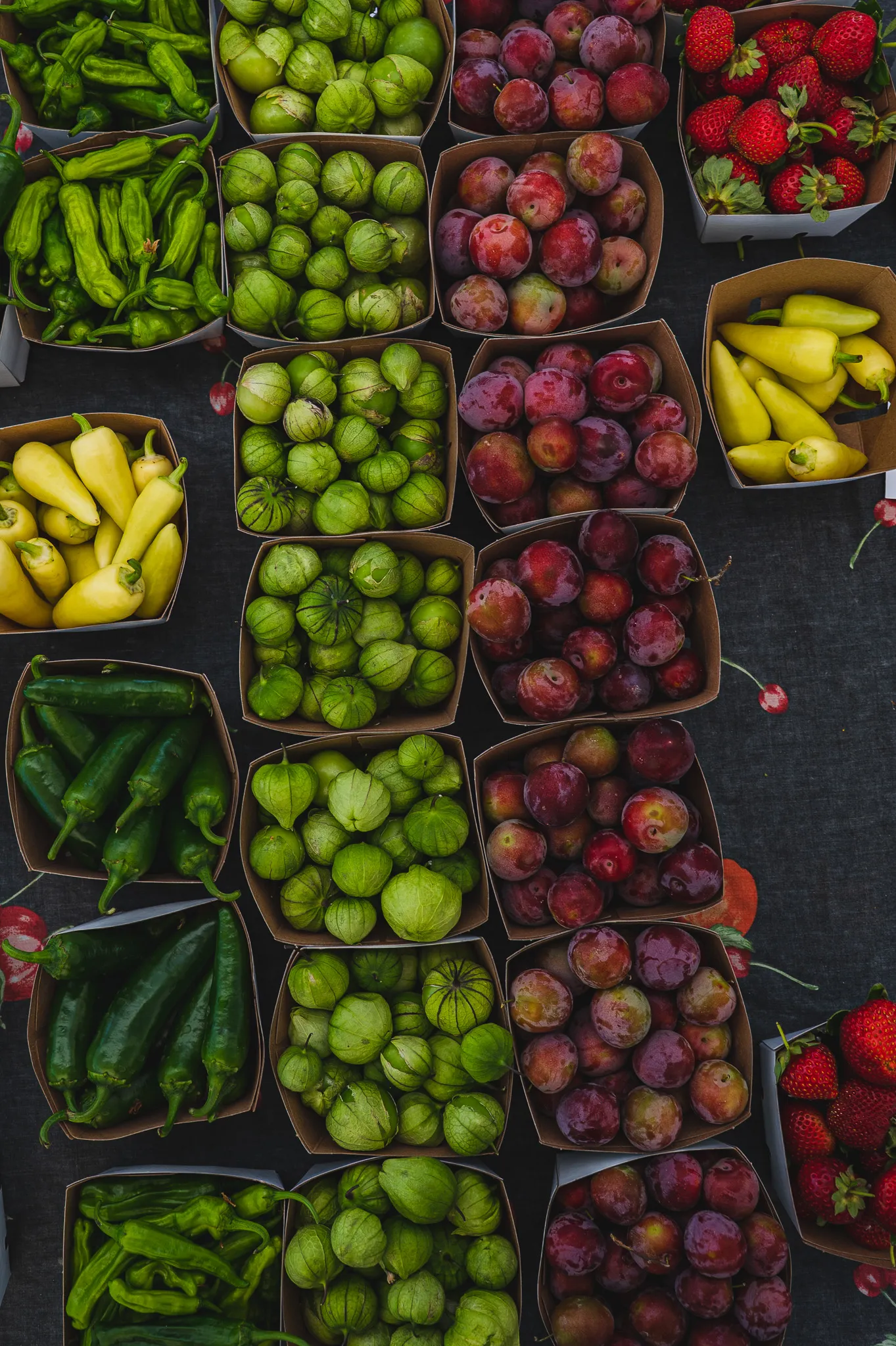 A market table piled with home-grown produce